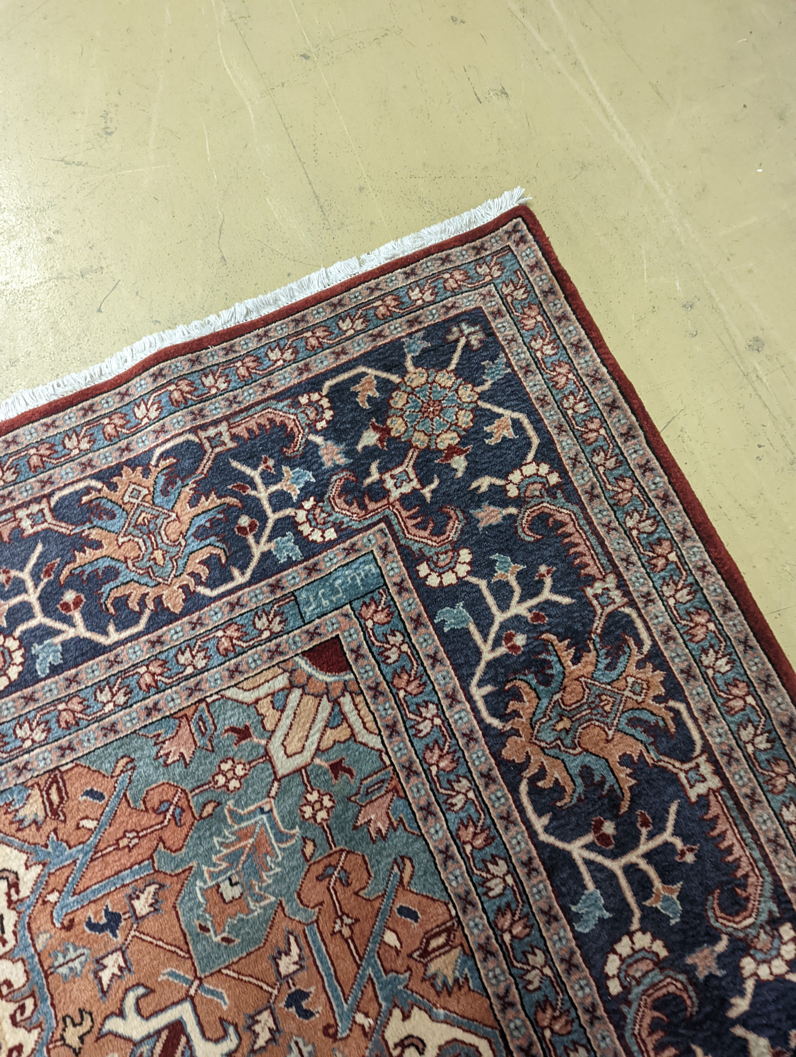 A large Caucasian style red ground carpet, 460 x 330cm